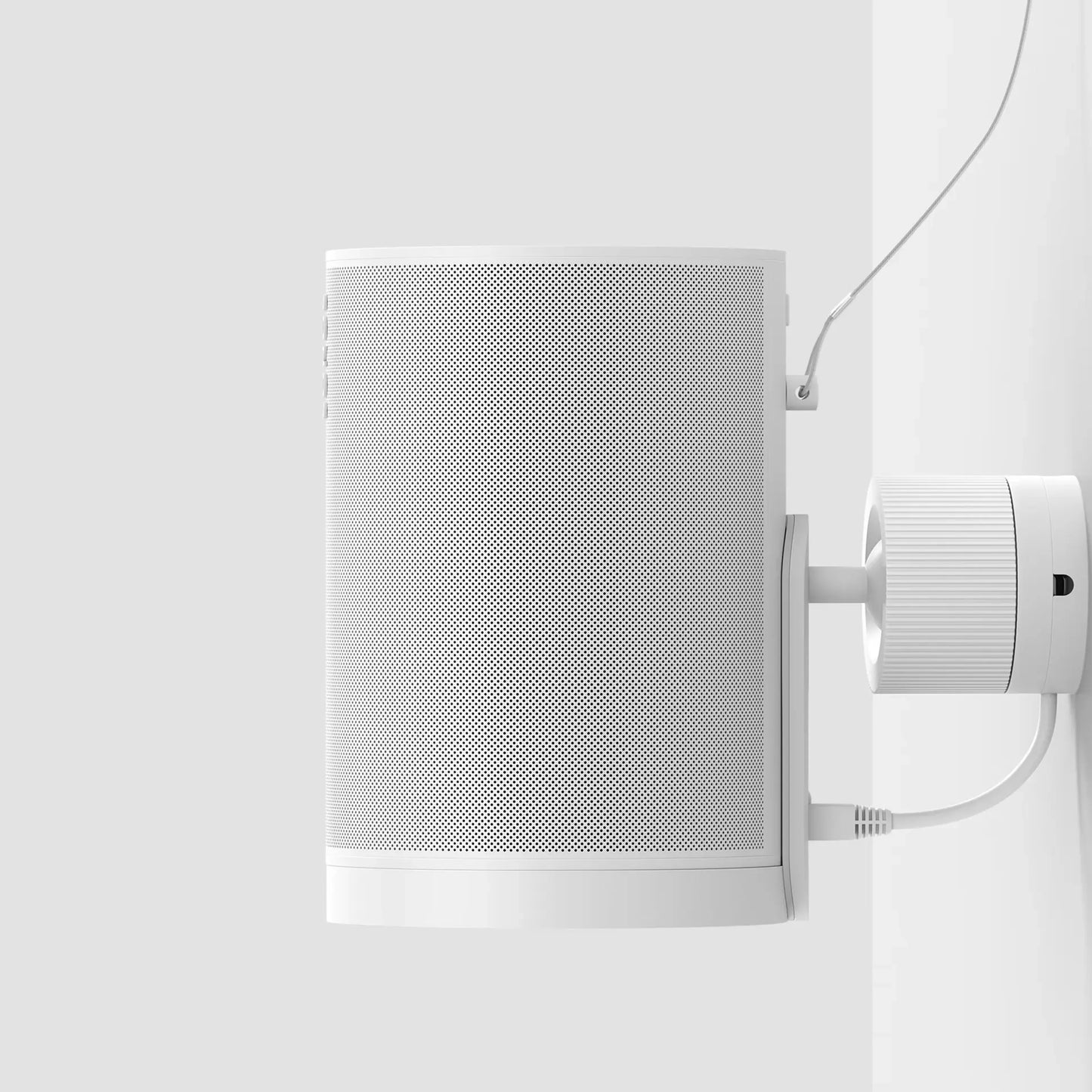 Image of a white Era 100 Pro speaker mounted on a wall, showcasing its sleek design and installation features.
